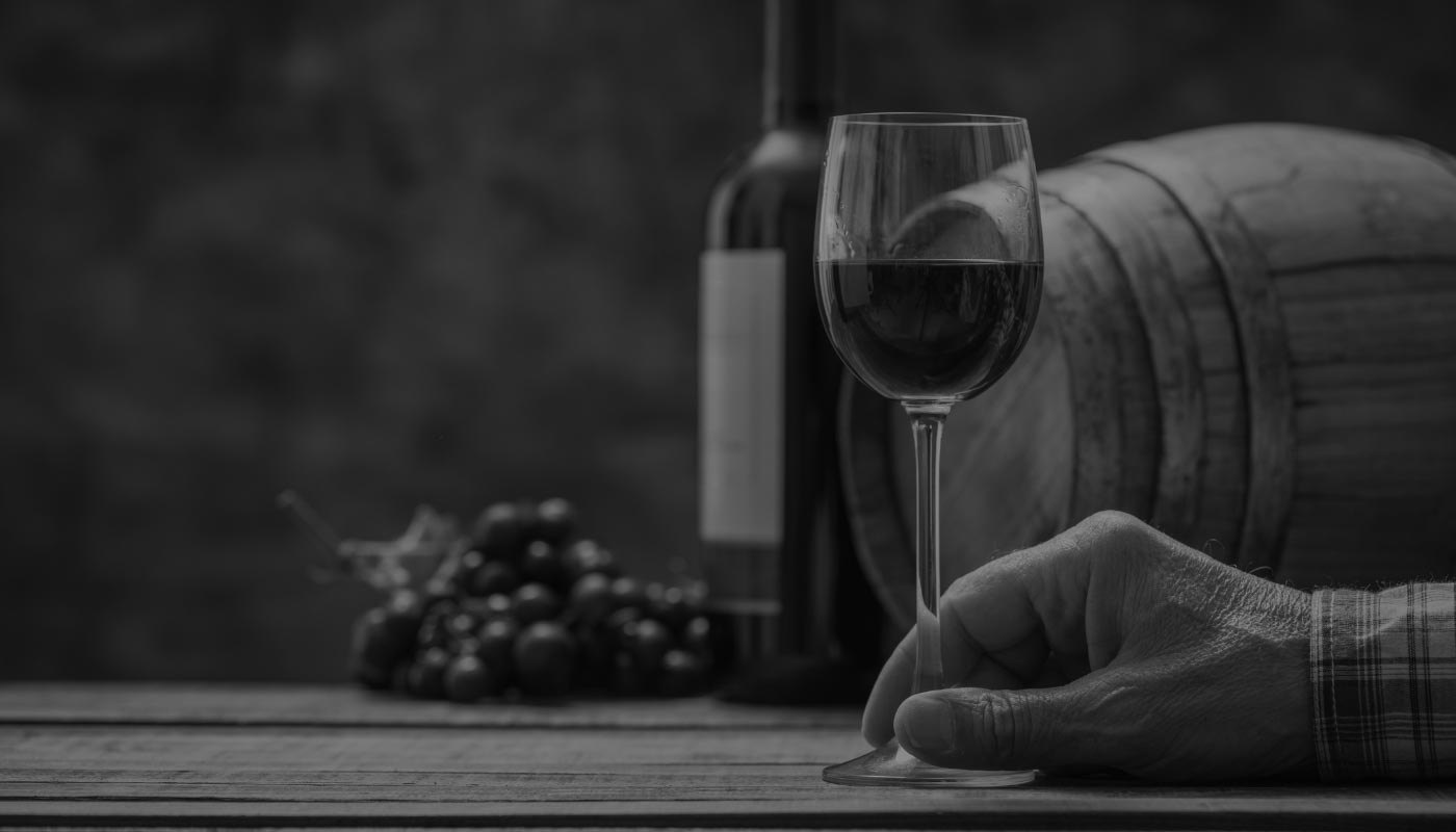 Hand holding a wine glass