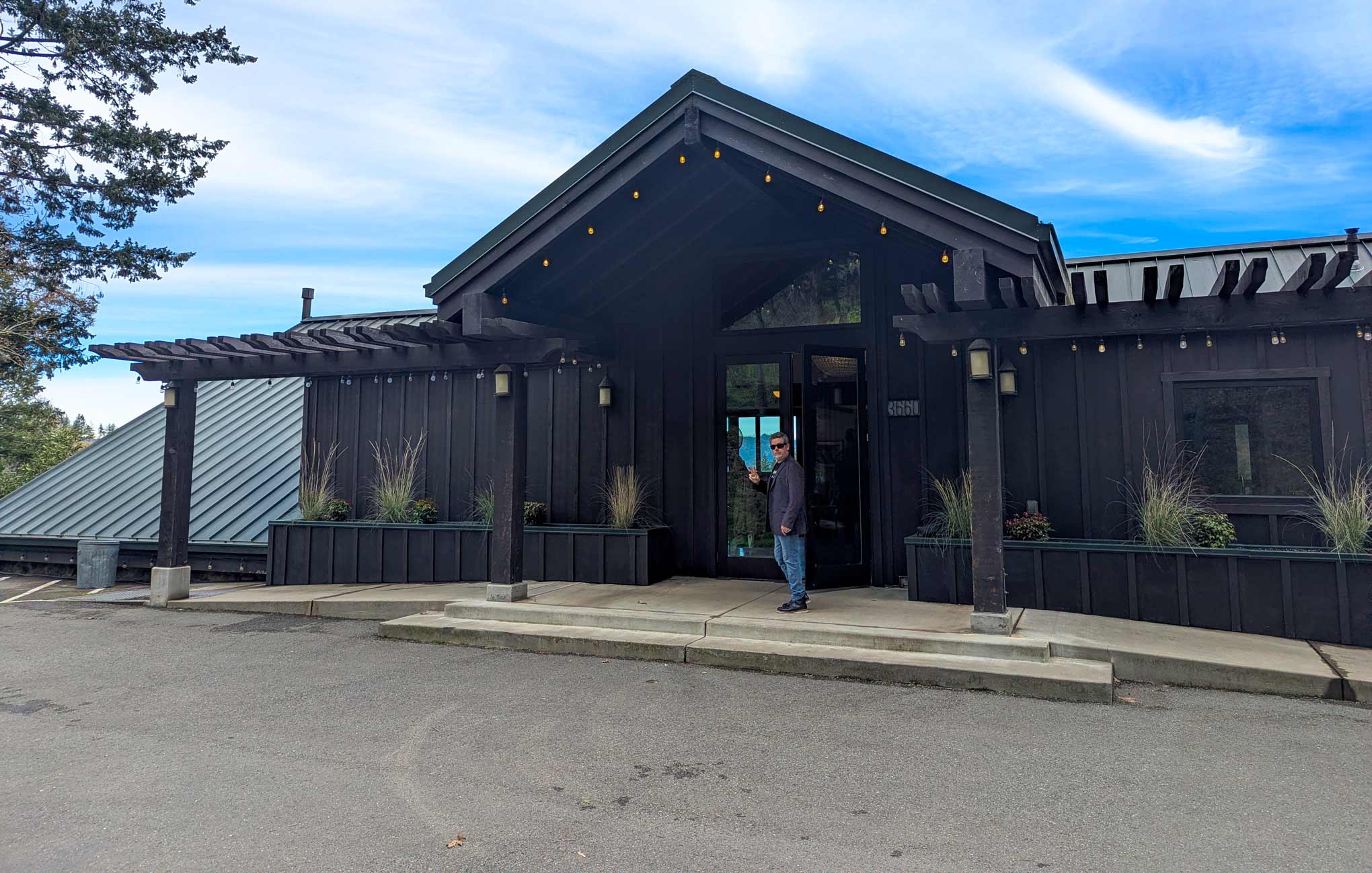 Chris arriving at the dark-painted entrance of Robert Keenan Winery on Spring Mountain, Napa Valley
