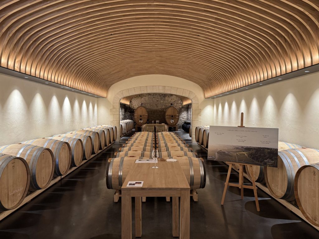 Dramatic arched wooden ceiling in the barrel cellar at Château Cos d'Estournel, Saint-Estèphe, Bordeaux