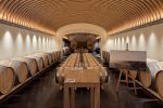 Dramatic arched wooden ceiling in the barrel cellar at Château Cos d'Estournel, Saint-Estèphe, Bordeaux