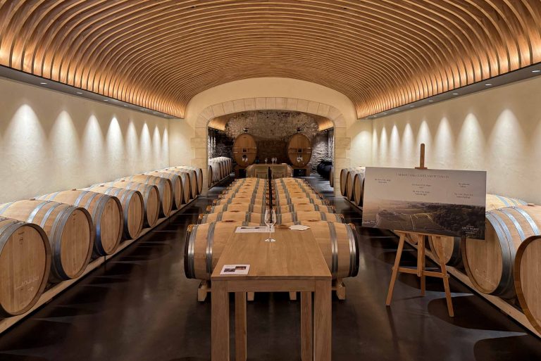 Dramatic arched wooden ceiling in the barrel cellar at Château Cos d'Estournel, Saint-Estèphe, Bordeaux