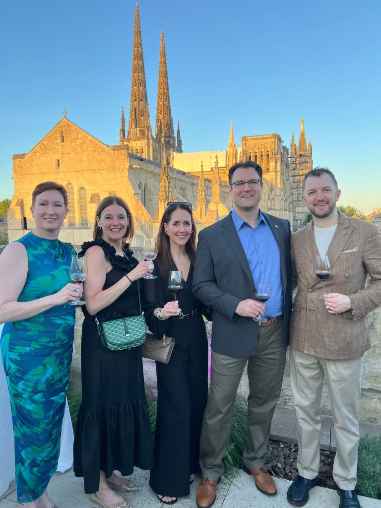 Saratoga Wine Exchange team at the Bordeaux 2025 En Primeur kickoff soiree, Saint-Émilion collegiate church
