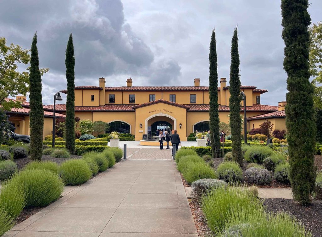 Domaine Serene winery entrance with Italian cypress trees lining the path in Willamette Valley Oregon