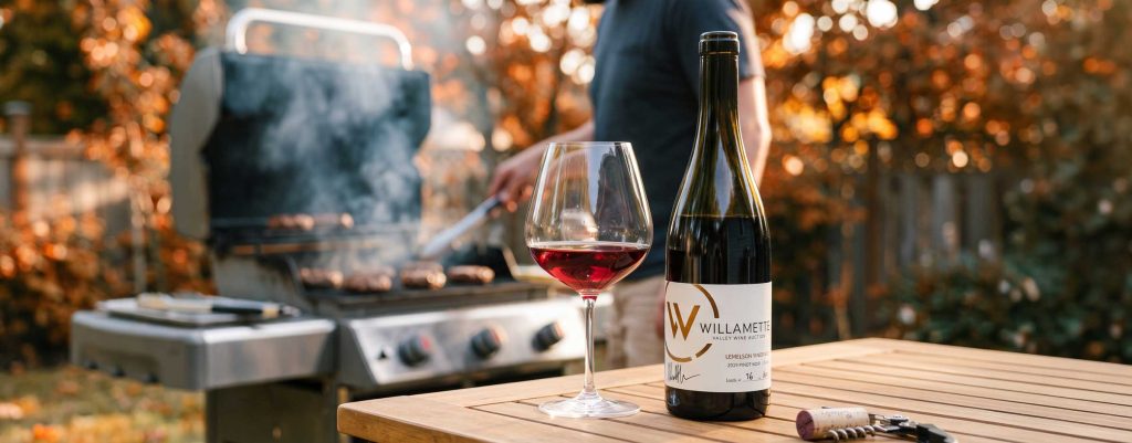 Willamette Pinot in front of burgers on the grill